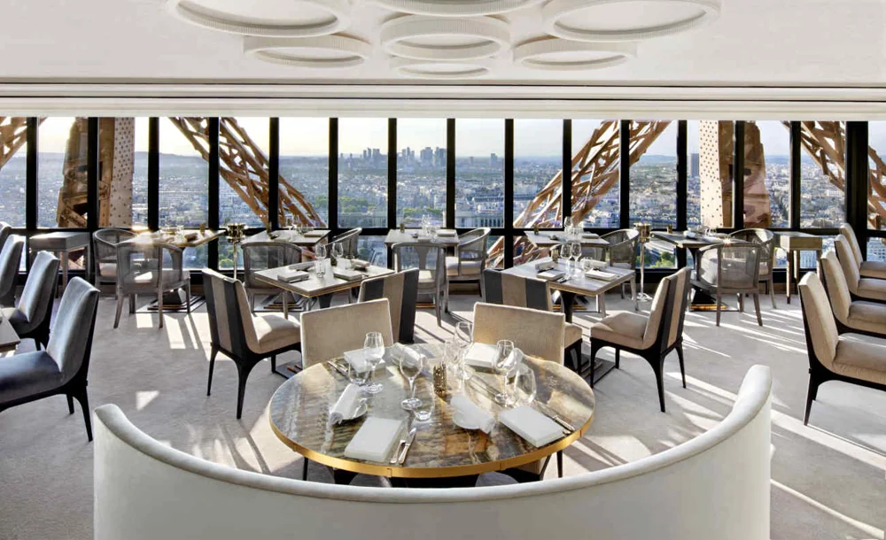 Set tables inside Le Jules Verne on the Eiffel Tower